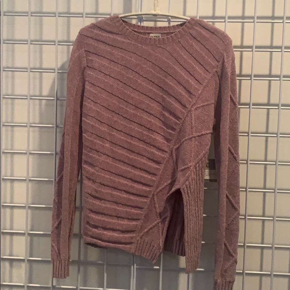 Chenille asymmetrical cable crew neck sweater.